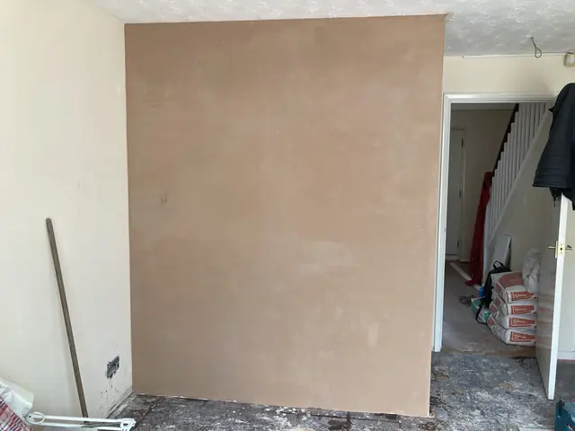 Freshly skimmed wall in a hallway, still drying out